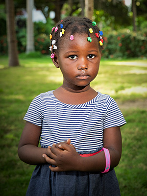 A little girl in an Edee Woosberline dress.