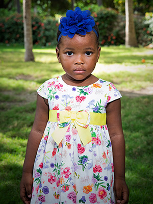 A little girl in a Bryana Liyah Vilsaint dress.