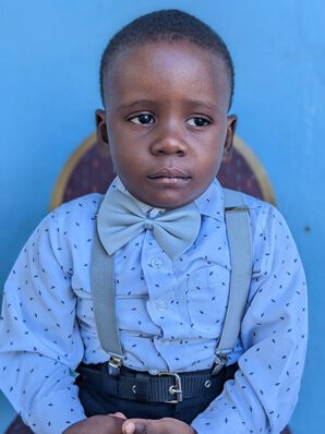 A young boy wearing Jaywens Blaise and suspenders.